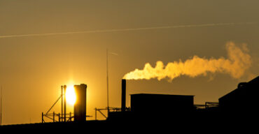 Pictured: A smoking factory in front of the sun in Cleveland Ohio.