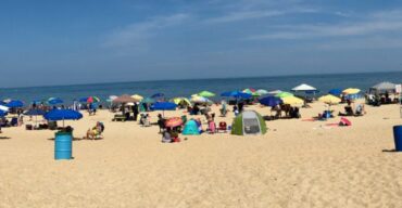 Pictured: A beach in Delaware with a lot of people.