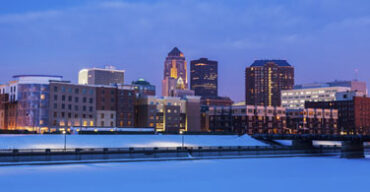 Pictured: A cityscape of Des Moines Iowa at night.
